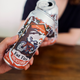 Toasting with two cans of Torched Earth, New Belgium's climate change-inspired beer.